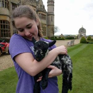Sara at Harlaxton with baby lamb